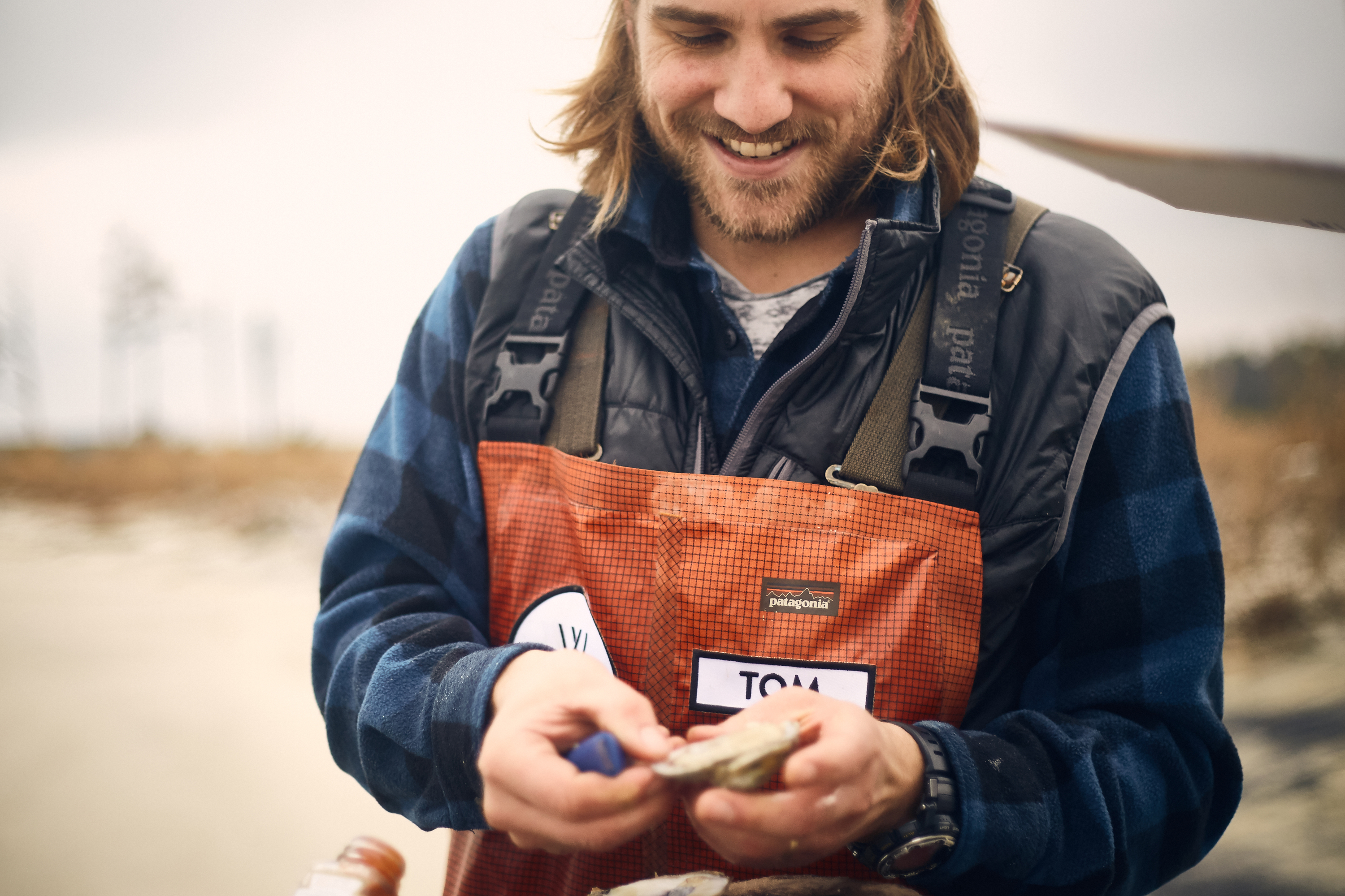 Farmer portrait — man with oysters in hand
